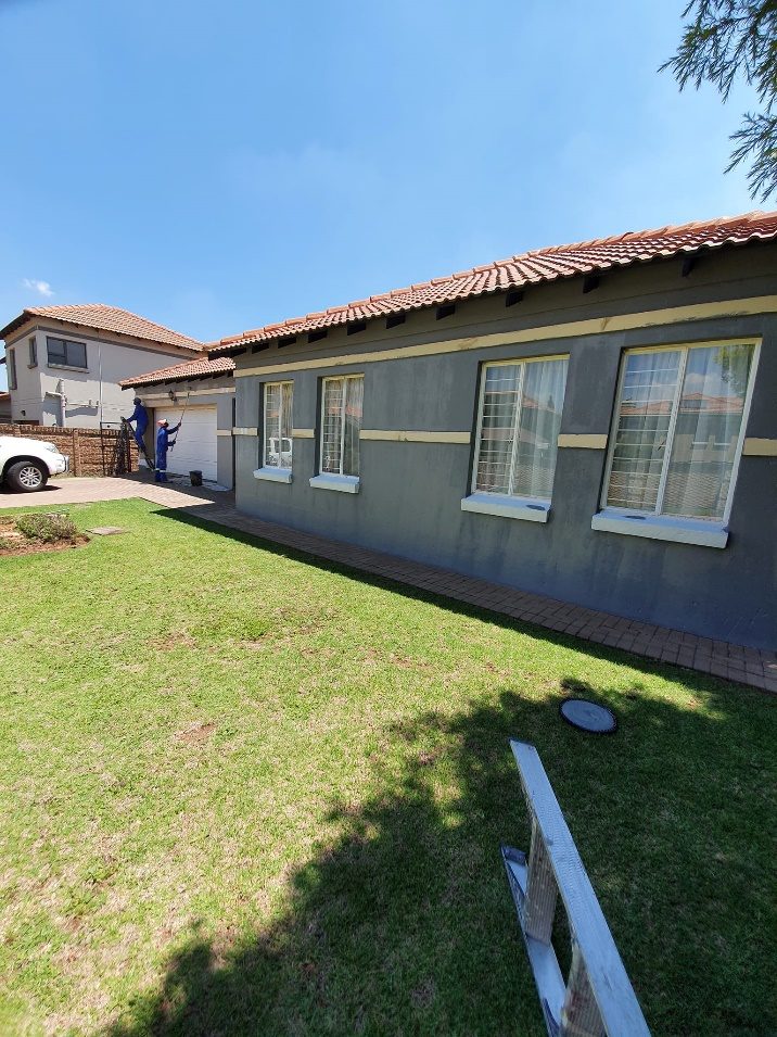 Completed exterior renovation and repaint of a residential property