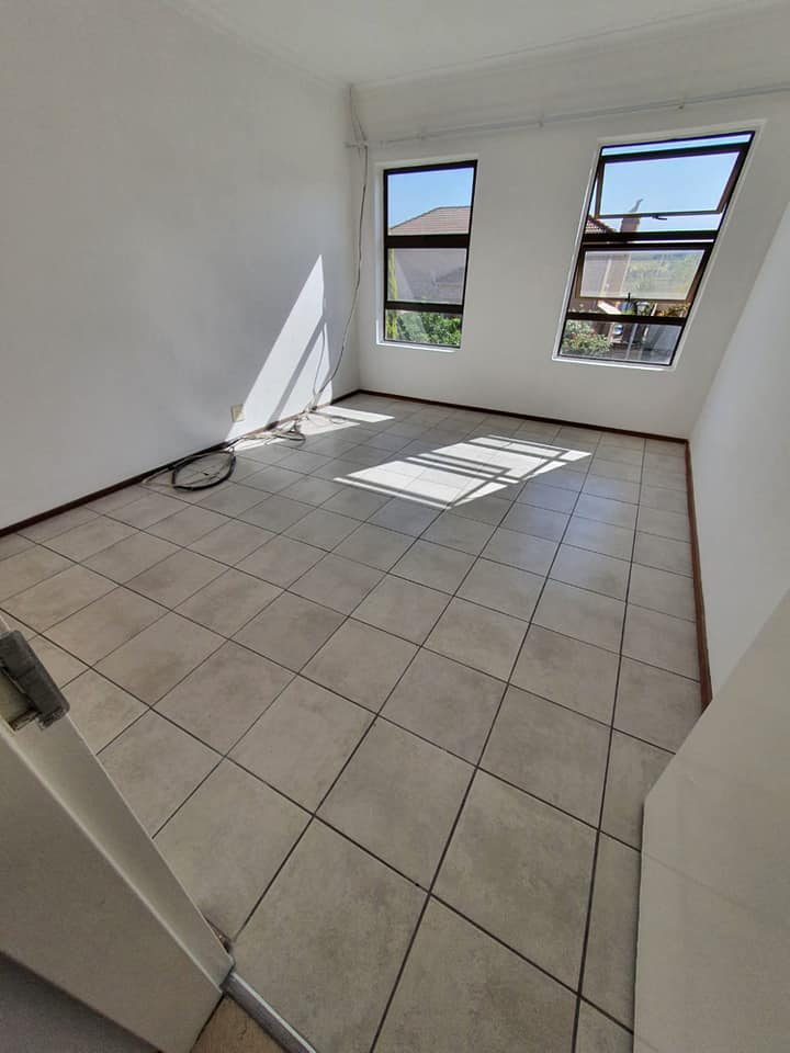 Interior room with newly laid floor tiling completed