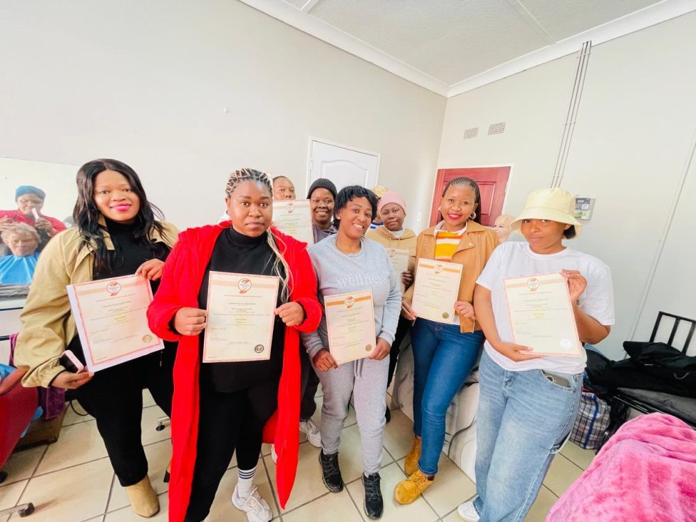 Learners holding certificates of competence at the training venue